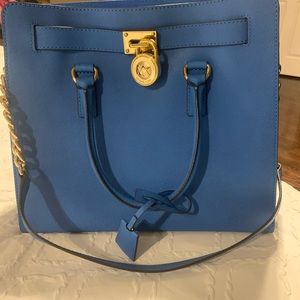 Beautiful large MK tote with handles. New without tags. No scuffs no marks